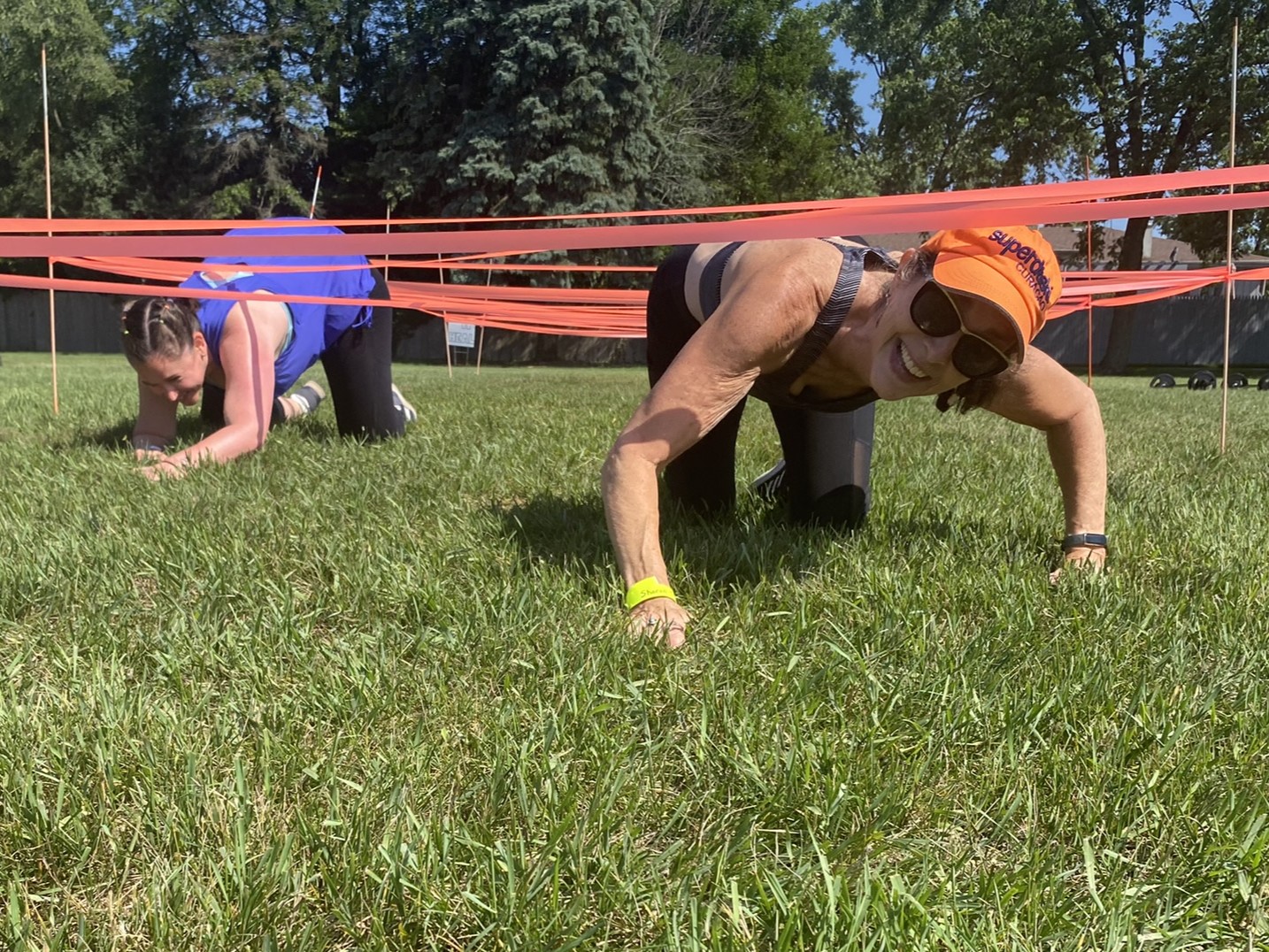 photo of participants crawling through obstacle