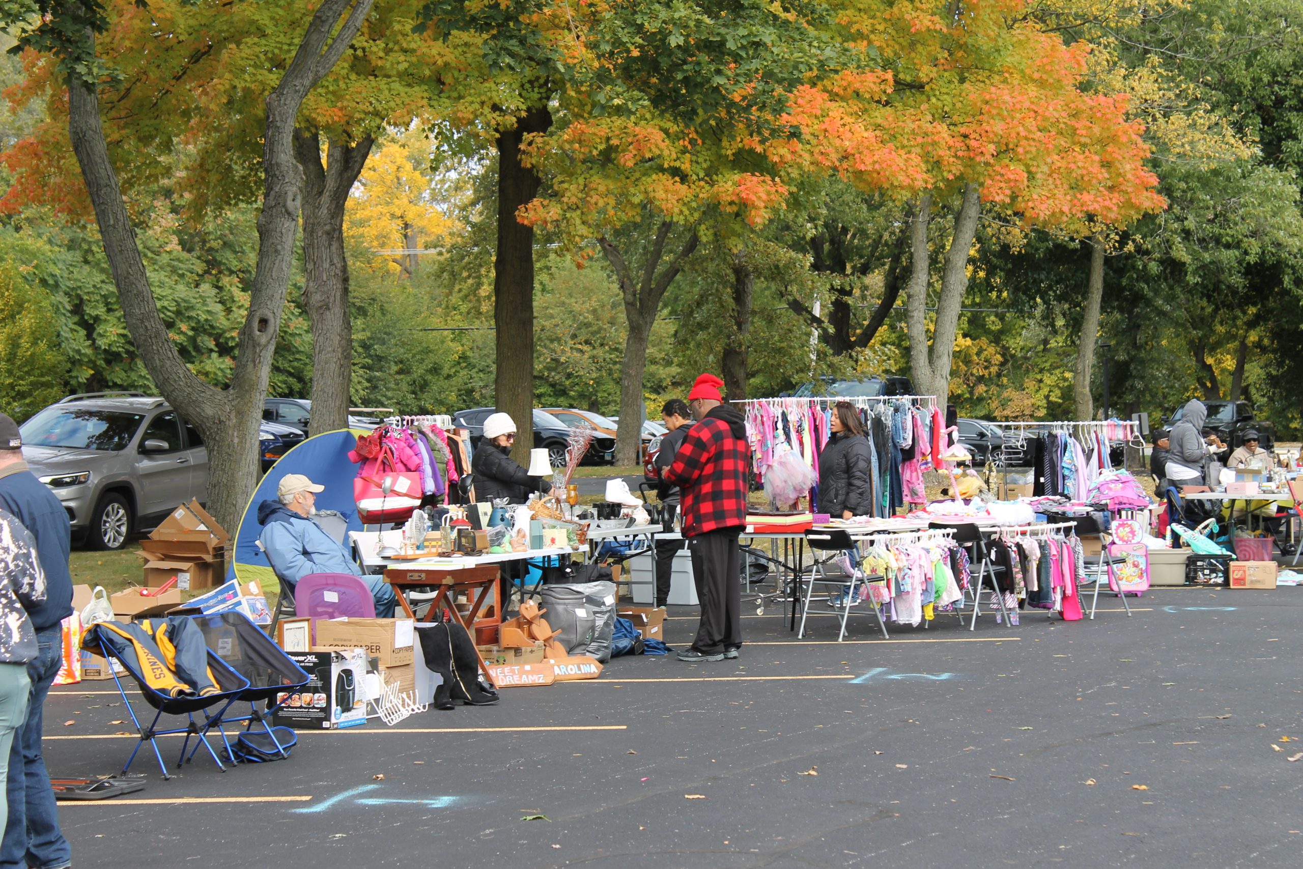 Photo of people shopping at Grandpa's Garage Sale.