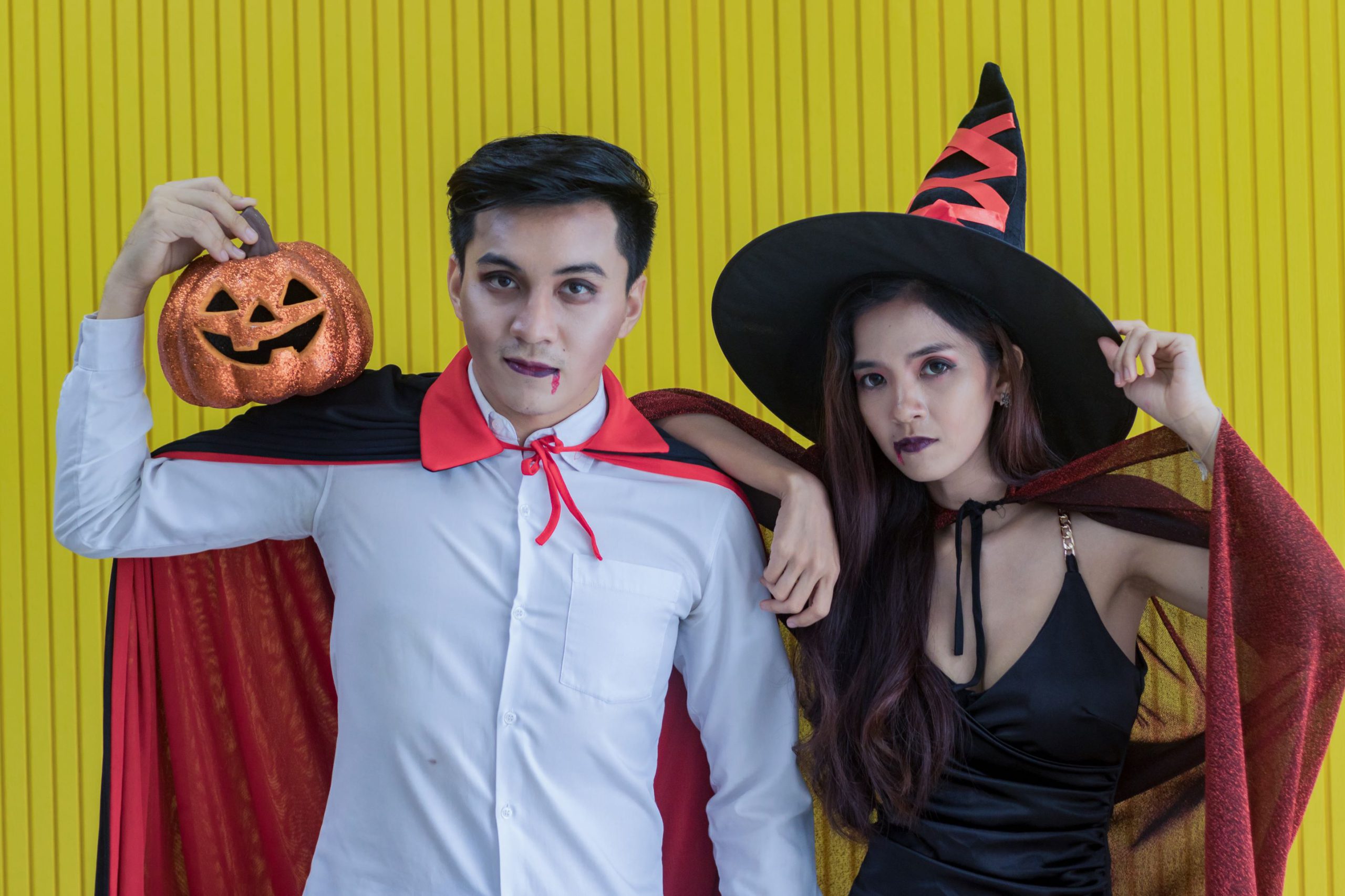 Photo of two teens in Halloween costumes.