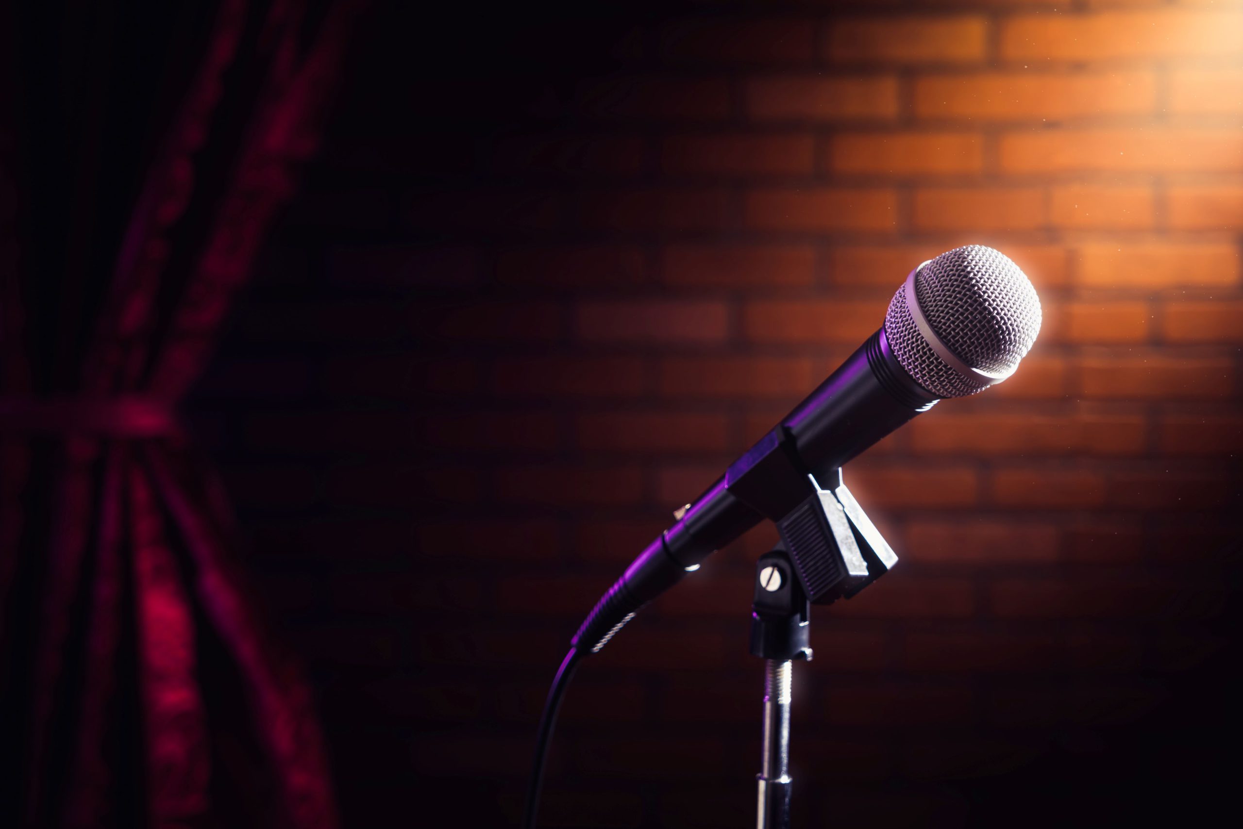 Photo of microphone in a spotlight.