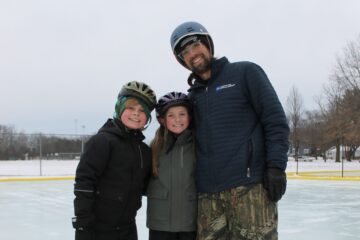 photo of family at the outdoor ice rink