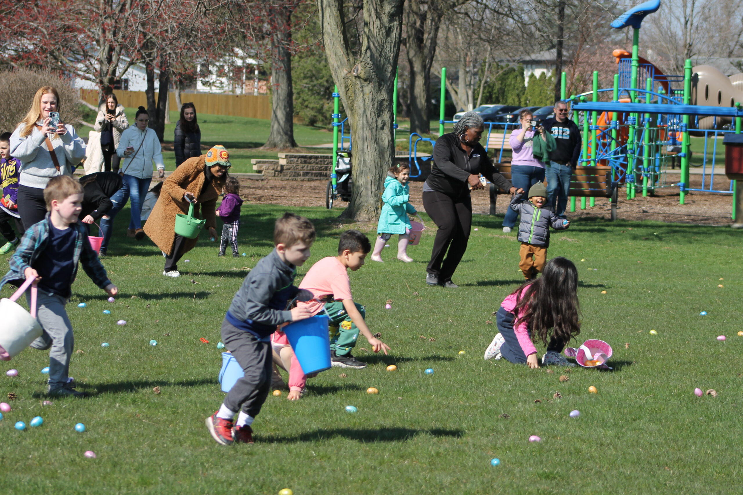 photo of kids collecting eggs at the lucky egg hunt