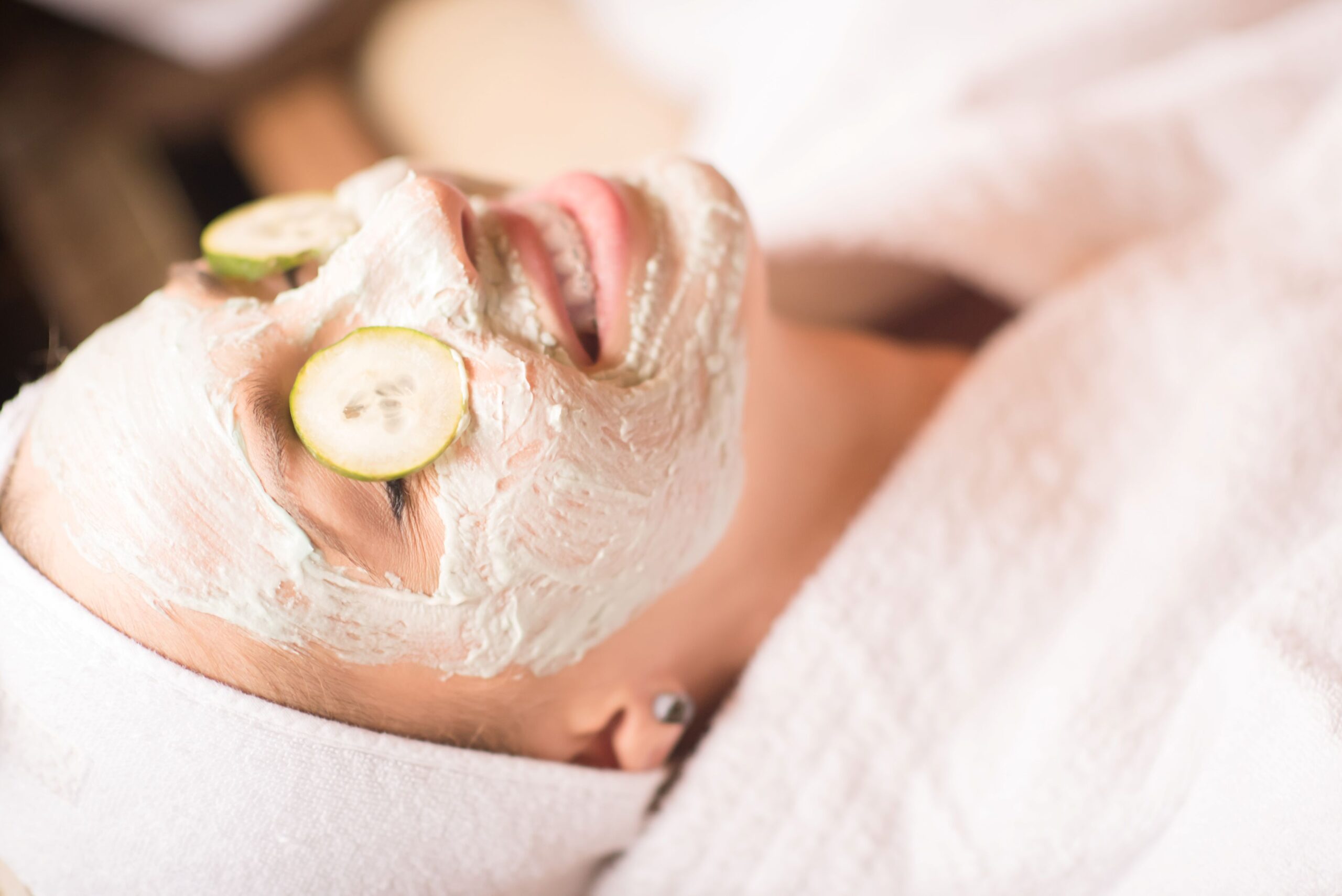 photo of woman at spa with facial mask
