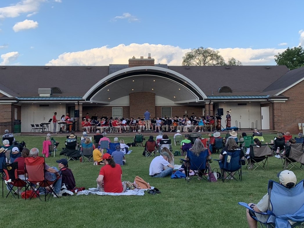 photo of group listening to a community band conert at irwin park