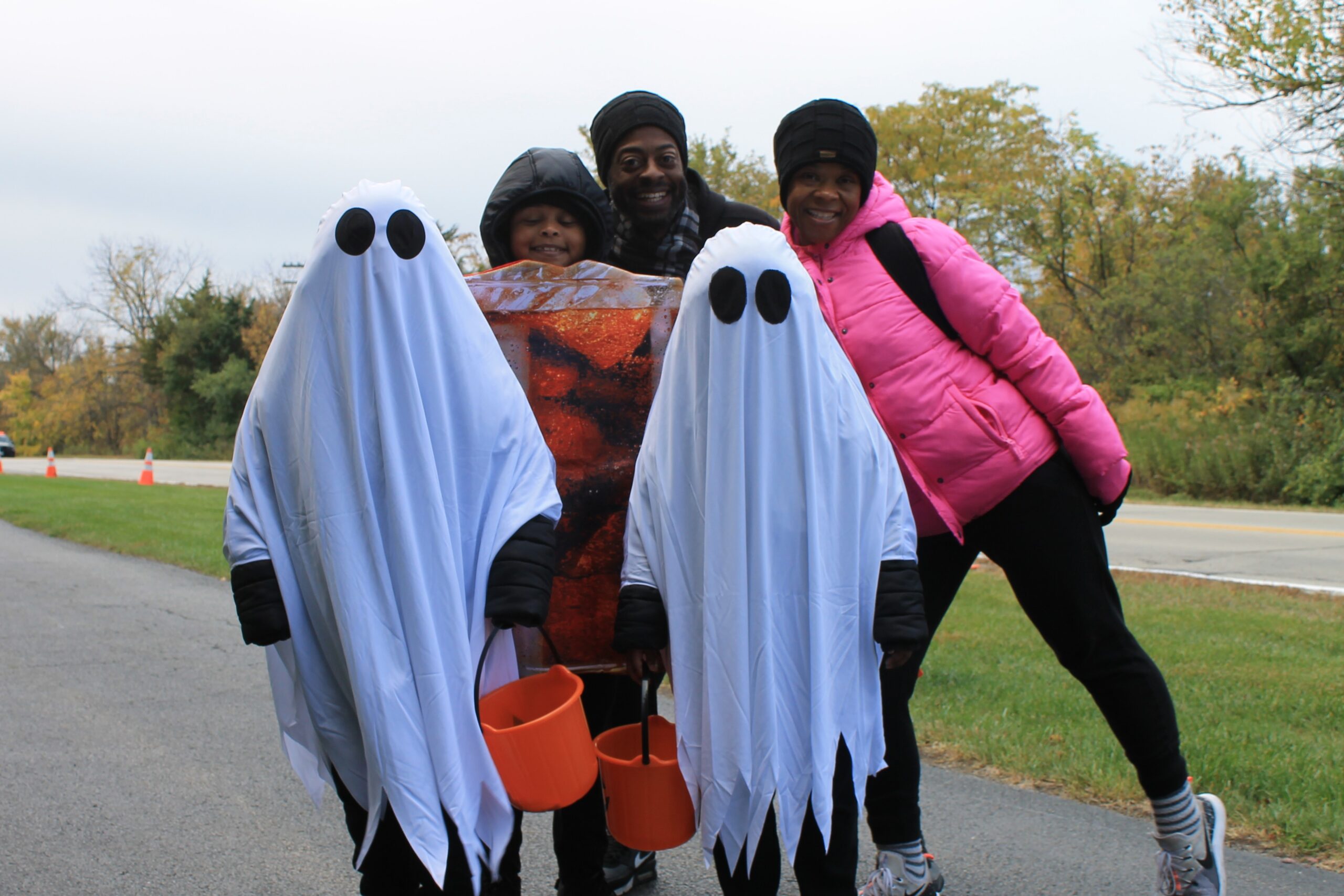 photo of a family in costume at the trick or treat trail
