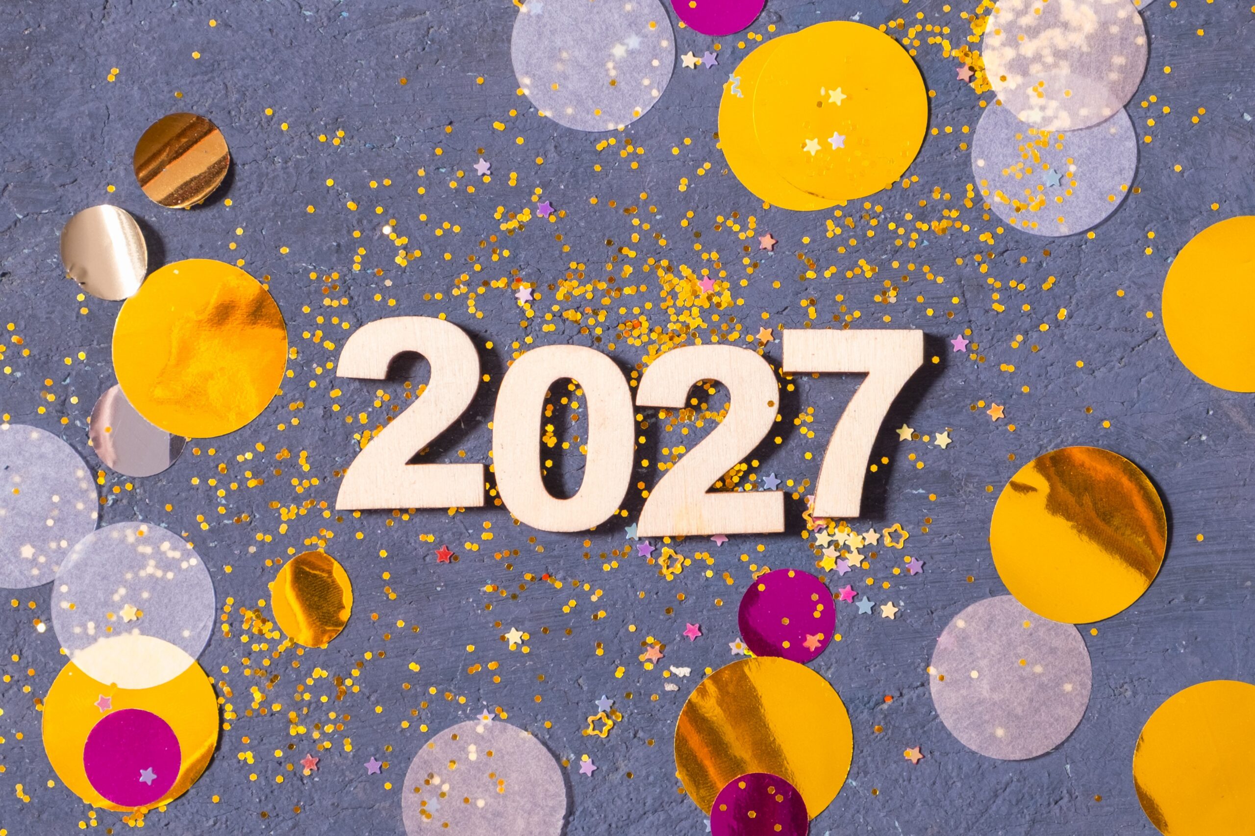 photo of New Year celebration for 2027 with colorful confetti and decorations on a dark background